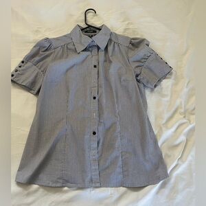 Fun top. Thin black stripes with bottom details on short sleeves